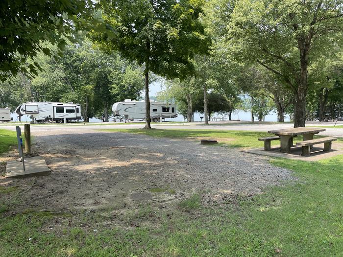 A photo of Site 041 of Loop LAKE at DEFEATED CREEK PARK with Picnic Table, Fire Pit, Shade, Full Hookup