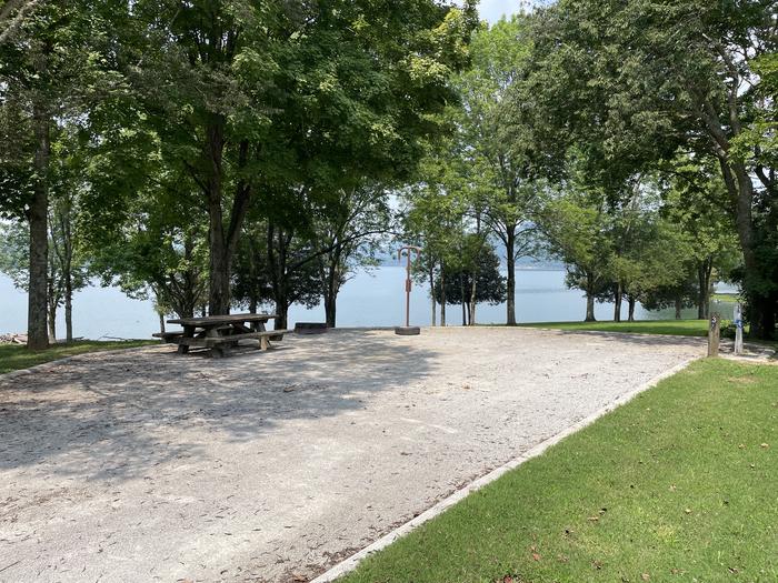 A photo of Site 038 of Loop LAKE at DEFEATED CREEK PARK with Picnic Table, Fire Pit, Shade, Full Hookup, Waterfront, Lantern Pole