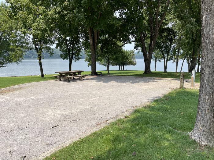 A photo of Site 048 of Loop LAKE at DEFEATED CREEK PARK with Picnic Table, Fire Pit, Full Hookup