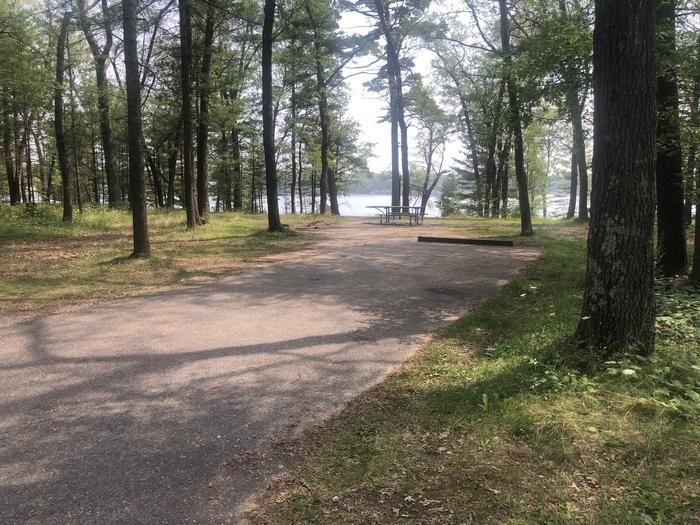 A photo of Site 08 of Loop ROUND LAKE at ROUND LAKE with Picnic Table, Fire Pit, Lantern Pole, wheel stop