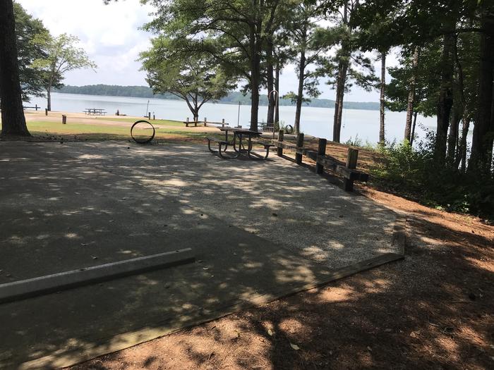 A photo of Site 069 of Loop LOOG at Holiday (Georgia) with Picnic Table, Electricity Hookup, Fire Pit, Shade, Waterfront, Lantern Pole, Water Hookup
