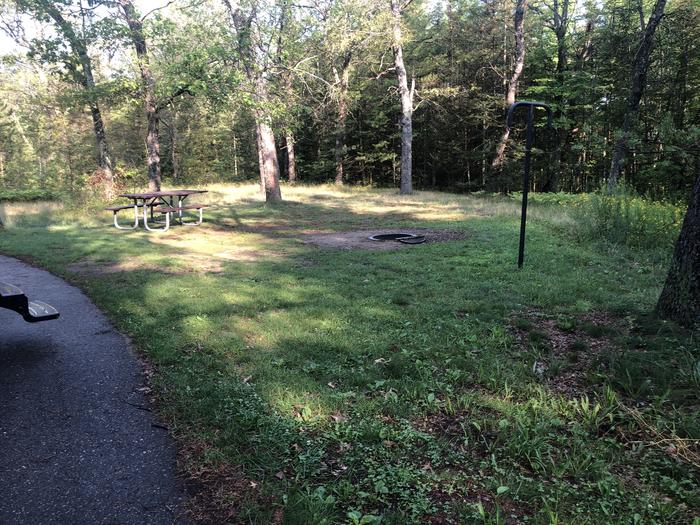 A photo of Site 010 of Loop ROLLWAYS CAMPGROUND at ROLLWAYS CAMPGROUND with Picnic Table, Food Storage, Lantern Pole