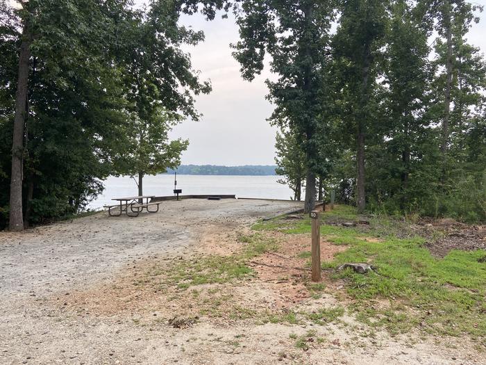 A photo of Site 50 of Loop SPRINGFIELD  at SPRINGFIELD with Picnic Table, Electricity Hookup, Fire Pit, Shade, Tent Pad, Waterfront, Lantern Pole, Water Hookup