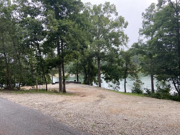 A photo of Site 62 of Loop SPRINGFIELD  at SPRINGFIELD with Picnic Table, Electricity Hookup, Fire Pit, Shade, Tent Pad, Waterfront, Lantern Pole, Water Hookup