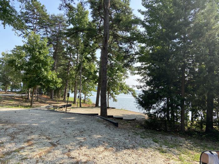 A photo of Site 14 of Loop SPRINGFIELD  at SPRINGFIELD with Picnic Table, Electricity Hookup, Fire Pit, Shade, Tent Pad, Waterfront, Lantern Pole, Water Hookup