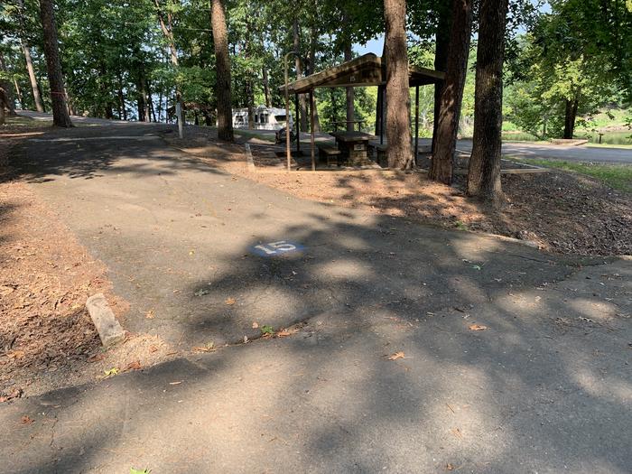 Entry drive showing culvert area.A photo of Site 15 of Loop QCOV at QUARRY COVE with Picnic Table, Electricity Hookup, Fire Pit, Lantern Pole, Water Hookup