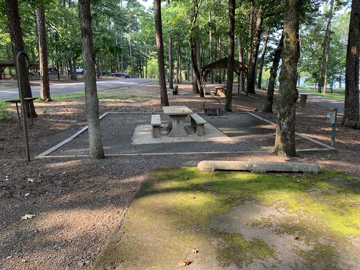 A photo of Site 06 of Loop QCOV at QUARRY COVE with Picnic Table, Electricity Hookup, Fire Pit, Shade, Lantern Pole, Water Hookup
