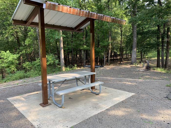 A photo of Site 05 of Loop QCOV at QUARRY COVE with Picnic Table, Electricity Hookup, Fire Pit, Tent Pad, Lantern Pole, Water Hookup
