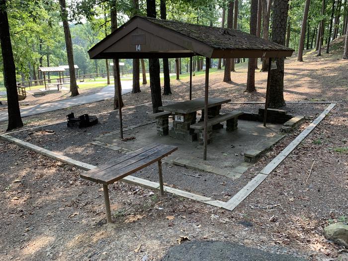A photo of Site 14 of Loop QCOV at QUARRY COVE with Picnic Table, Electricity Hookup, Fire Pit, Shade, Lantern Pole, Water Hookup