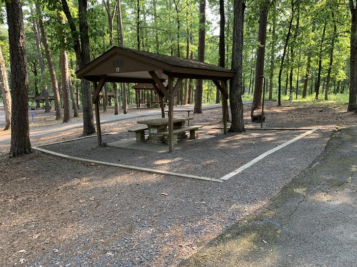 Close up of table area.A photo of Site 17 of Loop QCOV at QUARRY COVE with Picnic Table, Electricity Hookup, Fire Pit, Shade, Lantern Pole, Water Hookup