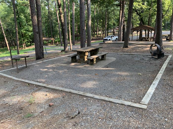 A photo of Site 08 of Loop QCOV at QUARRY COVE with Picnic Table, Electricity Hookup, Fire Pit, Shade, Lantern Pole, Water Hookup
