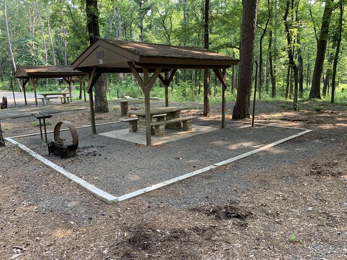 A photo of Site 20 of Loop QCOV at QUARRY COVE with Picnic Table, Electricity Hookup, Fire Pit, Shade, Lantern Pole, Water Hookup