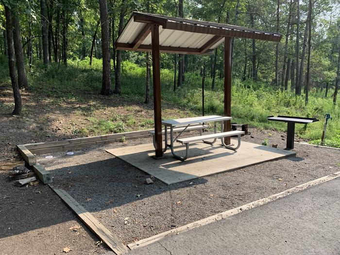 Close up of table area.A photo of Site 31 of Loop QCOV at QUARRY COVE with Picnic Table, Electricity Hookup, Fire Pit, Lantern Pole, Water Hookup