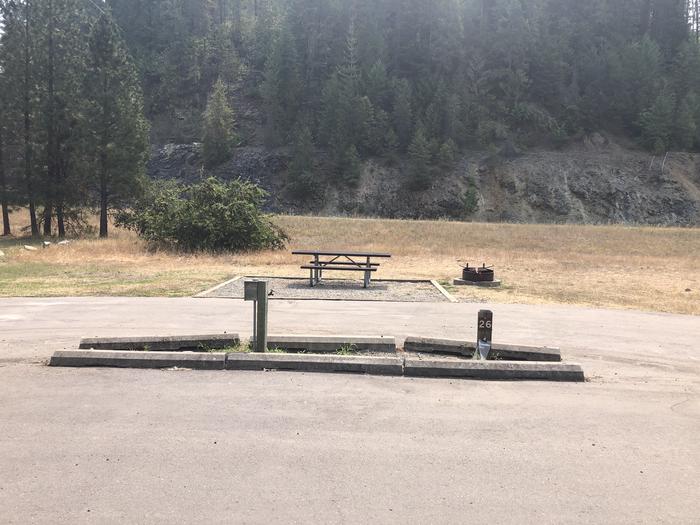 A photo of Site 26 of Loop A at Huckleberry Campground  with Picnic Table, Electricity Hookup, Fire Pit, Tent Pad, Water Hookup