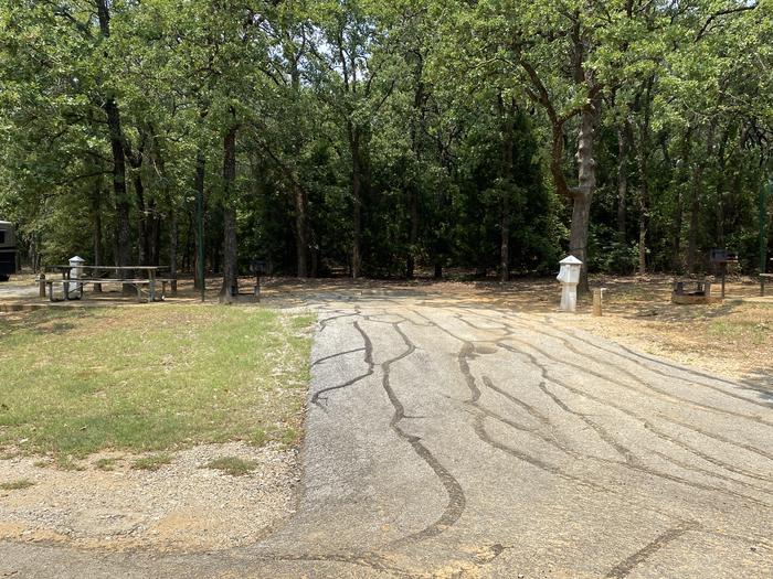 A photo of Site 032 of Loop HICKORY CREEK  at HICKORY CREEK with Boat Ramp, Picnic Table, Electricity Hookup, Fire Pit, Shade, Lantern Pole, Water Hookup