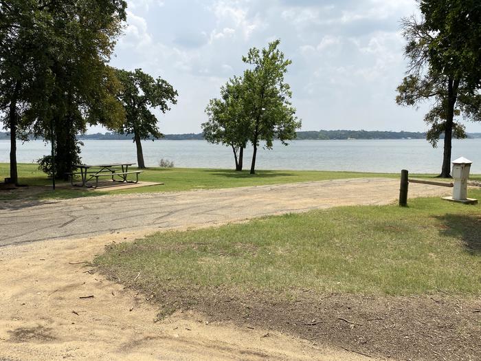 A photo of Site 028 of Loop HICKORY CREEK  at HICKORY CREEK with Boat Ramp, Picnic Table, Electricity Hookup, Fire Pit, Waterfront, Lantern Pole, Water Hookup
