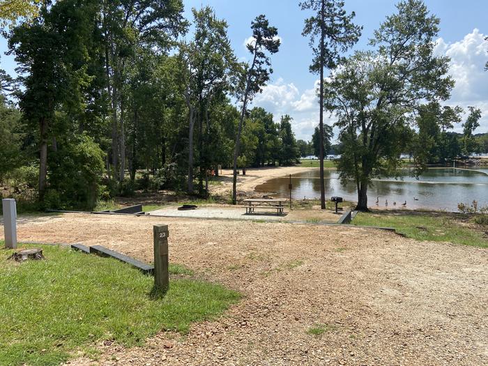 A photo of Site 23 of Loop SPRINGFIELD  at SPRINGFIELD with Picnic Table, Electricity Hookup, Fire Pit, Tent Pad, Waterfront, Lantern Pole, Water Hookup