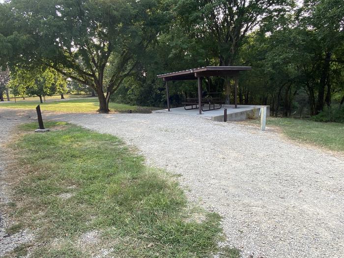 A photo of Site 009 of Loop SFET at SANTA FE TRAIL with Picnic Table, Electricity Hookup, Fire Pit, Shade, Waterfront, Water Hookup