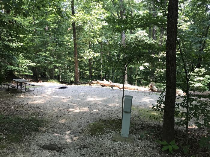 A photo of Site 168 of Loop PINE at HARDIN RIDGE with Picnic Table, Electricity Hookup, Fire Pit, Shade, Tent Pad, Lantern Pole
