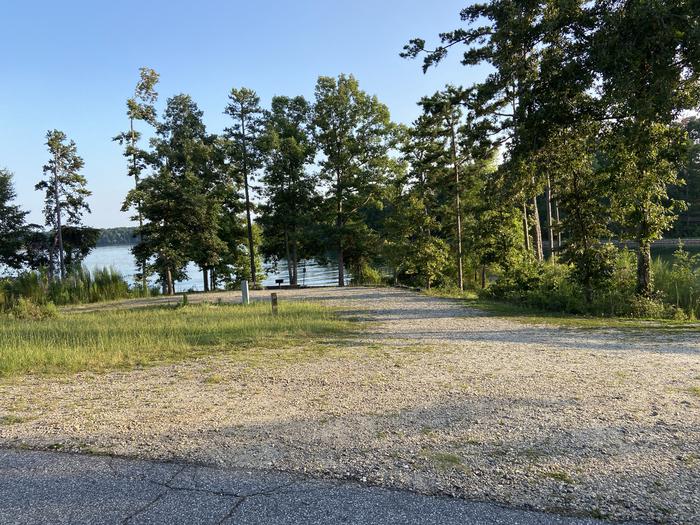 A photo of Site 73 of Loop SPRINGFIELD  at SPRINGFIELD with Picnic Table, Electricity Hookup, Fire Pit, Shade, Tent Pad, Waterfront, Lantern Pole, Water Hookup