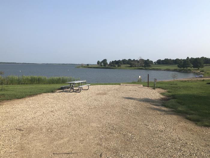 A photo of Site A-002 of Loop A at WEST ROLLING HILLS with Picnic Table, Electricity Hookup, Fire Pit, Waterfront, Water Hookup