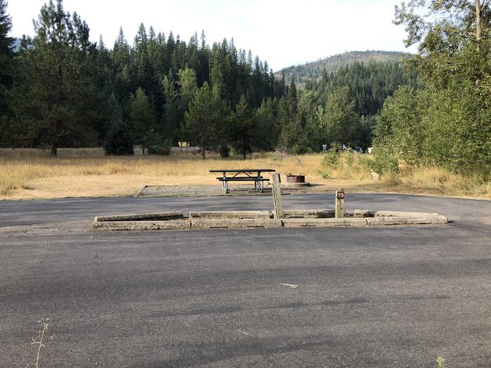 A photo of Site 25 of Loop A at Huckleberry Campground  with Picnic Table, Electricity Hookup, Fire Pit, Tent Pad, Water Hookup
