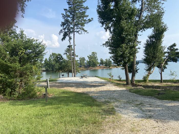 A photo of Site 20 of Loop SPRINGFIELD  at SPRINGFIELD with Picnic Table, Electricity Hookup, Fire Pit, Shade, Tent Pad, Waterfront, Lantern Pole, Water Hookup