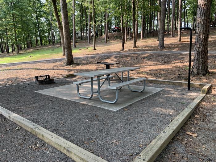 A photo of Site 22 of Loop QCOV at QUARRY COVE with Picnic Table, Electricity Hookup, Fire Pit, Shade, Lantern Pole, Water Hookup