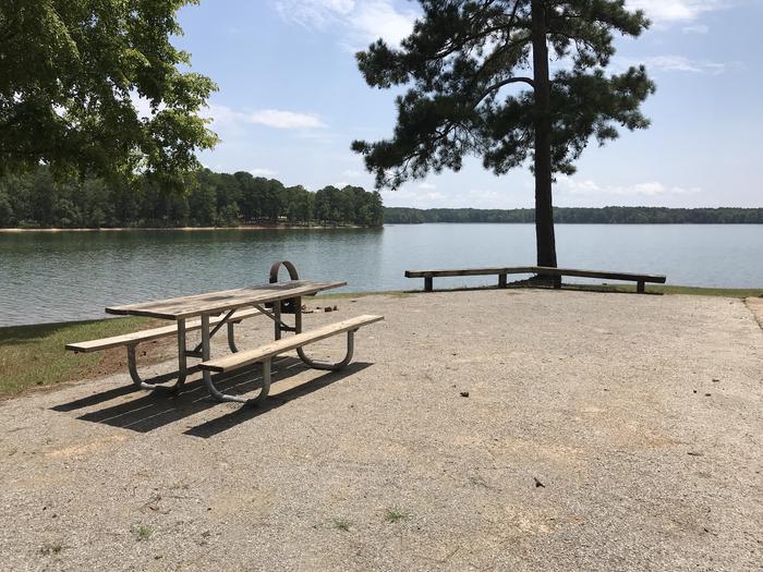 A photo of Site 112 of Loop LOOJ at Holiday (Georgia) with Picnic Table, Electricity Hookup, Fire Pit, Tent Pad, Waterfront, Lantern Pole, Water Hookup
