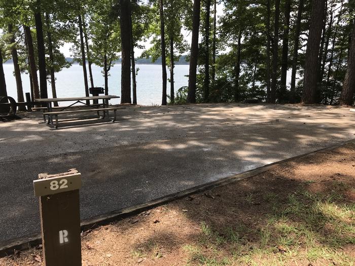 A photo of Site 082 of Loop LOOG at Holiday (Georgia) with Picnic Table, Electricity Hookup, Fire Pit, Shade, Tent Pad, Waterfront, Lantern Pole, Water Hookup