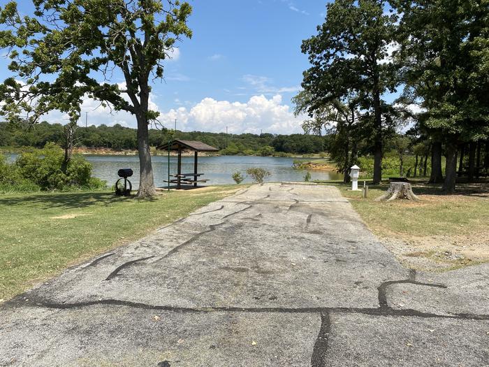 A photo of Site 091 of Loop HICKORY CREEK  at HICKORY CREEK with Boat Ramp, Picnic Table, Electricity Hookup, Fire Pit, Lantern Pole, Water Hookup, Lean To / Shelter
