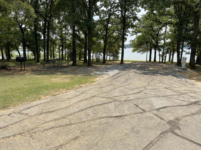 A photo of Site 033 of Loop HICKORY CREEK  at HICKORY CREEK with Boat Ramp, Picnic Table, Electricity Hookup, Fire Pit, Shade, Waterfront, Lantern Pole, Water Hookup