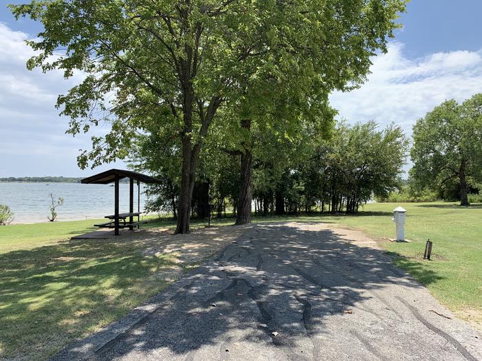 A photo of Site 087 of Loop HICKORY CREEK  at HICKORY CREEK with Boat Ramp, Picnic Table, Electricity Hookup, Fire Pit, Waterfront, Lantern Pole, Water Hookup, Lean To / Shelter