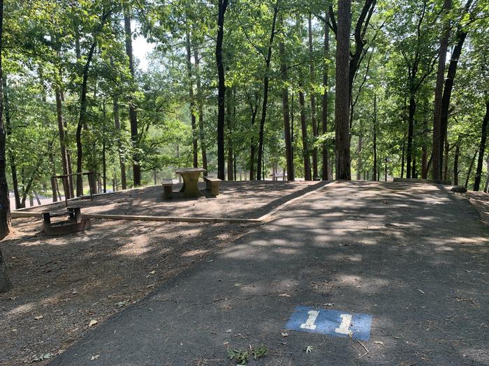 A photo of Site 11 of Loop QCOV at QUARRY COVE with Picnic Table, Electricity Hookup, Fire Pit, Shade, Water Hookup