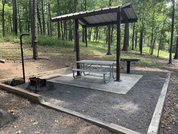 A photo of Site 30 of Loop QCOV at QUARRY COVE with Picnic Table, Electricity Hookup, Fire Pit, Water Hookup