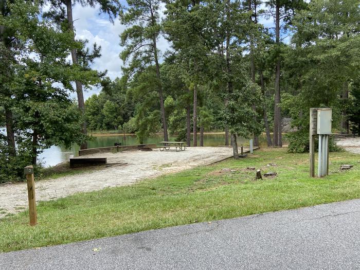 A photo of Site 03 of Loop SPRINGFIELD  at SPRINGFIELD with Picnic Table, Electricity Hookup, Fire Pit, Shade, Tent Pad, Waterfront, Lantern Pole, Water Hookup