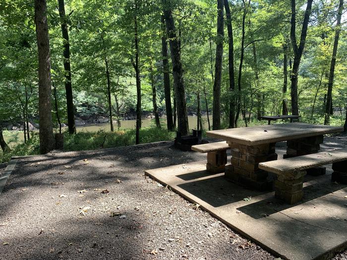 A photo of Site 015 of Loop RROA at RIVER ROAD with Picnic Table, Electricity Hookup, Fire Pit, Shade, Water Hookup
