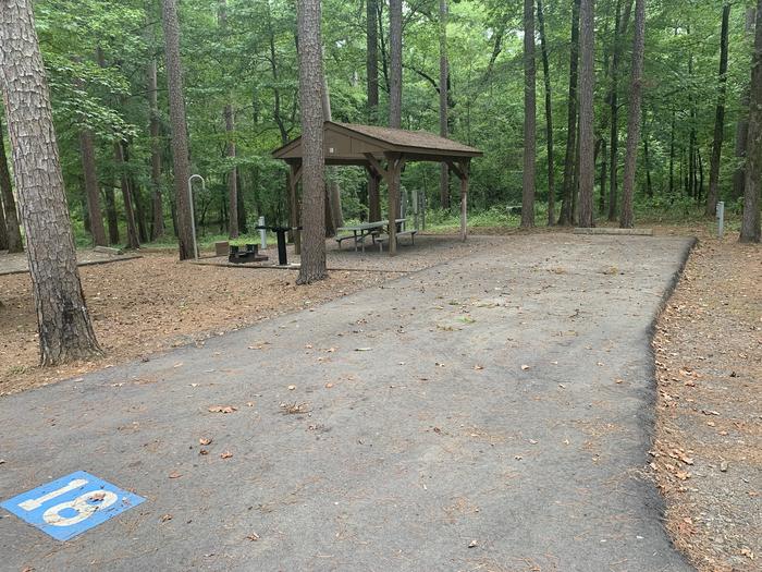 A photo of Site 18 of Loop CARTER COVE  at CARTER COVE with Picnic Table, Electricity Hookup, Fire Pit, Shade, Lantern Pole, Water Hookup