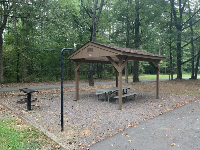 A photo of Site 34 of Loop CARTER COVE  at CARTER COVE with Picnic Table, Fire Pit, Shade, Lantern Pole