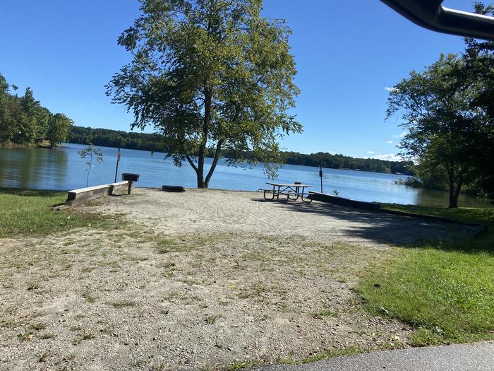 A photo of Site 45 of Loop SPRINGFIELD  at SPRINGFIELD with Picnic Table, Electricity Hookup, Fire Pit, Shade, Tent Pad, Waterfront, Lantern Pole, Water Hookup