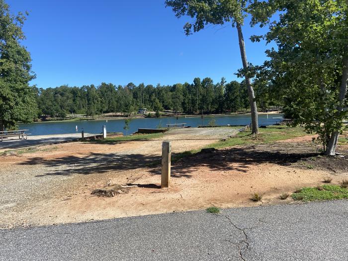A photo of Site 30 of Loop SPRINGFIELD  at SPRINGFIELD with Picnic Table, Electricity Hookup, Fire Pit, Tent Pad, Waterfront, Lantern Pole, Water Hookup