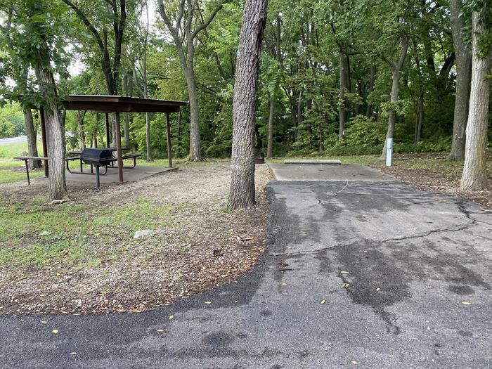 A photo of Site 004 of Loop RCOV at RICHEY COVE with Picnic Table, Electricity Hookup, Fire Pit, Shade