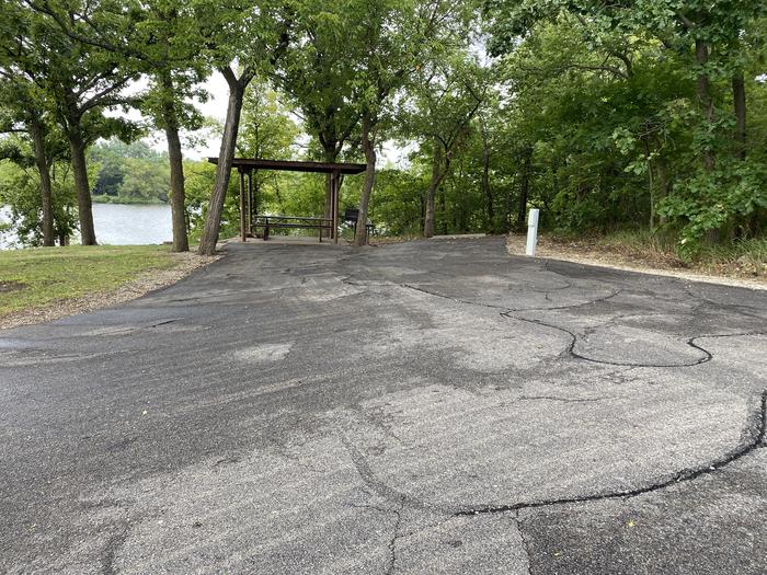 A photo of Site 001 of Loop RCOV at RICHEY COVE with Boat Ramp, Picnic Table, Electricity Hookup, Fire Pit, Shade, Waterfront
