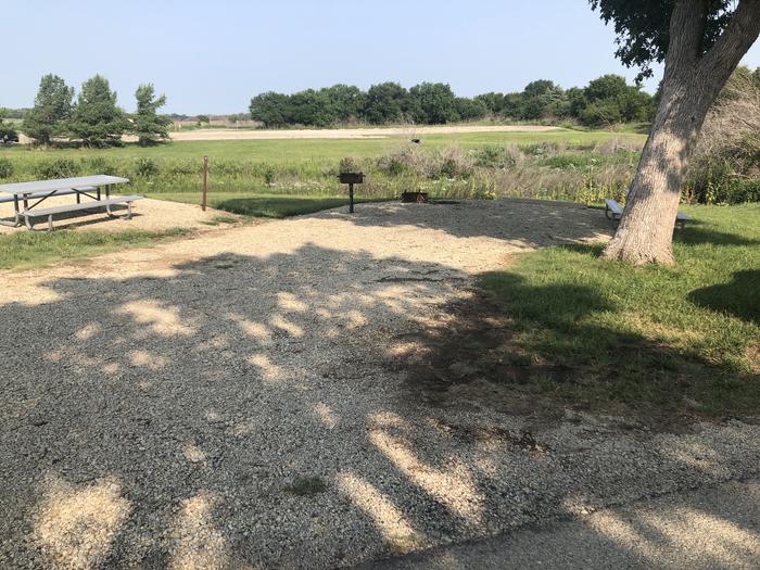 A photo of Site A013 of Loop A at CURTIS CREEK with Picnic Table, Electricity Hookup, Fire Pit, Shade, Water Hookup