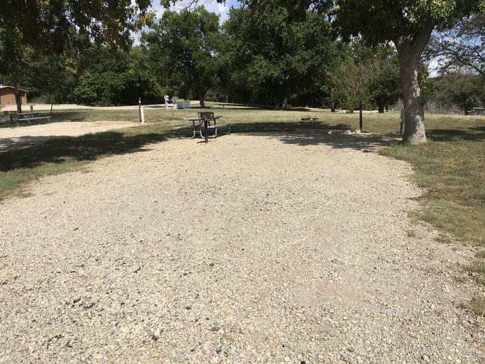A photo of Site A003 of Loop A at CURTIS CREEK with Picnic Table, Fire Pit, Shade, Water Hookup