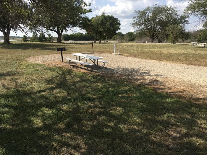 A photo of Site A008 of Loop A at CURTIS CREEK with Picnic Table, Fire Pit, Shade left of site, Water Hookup