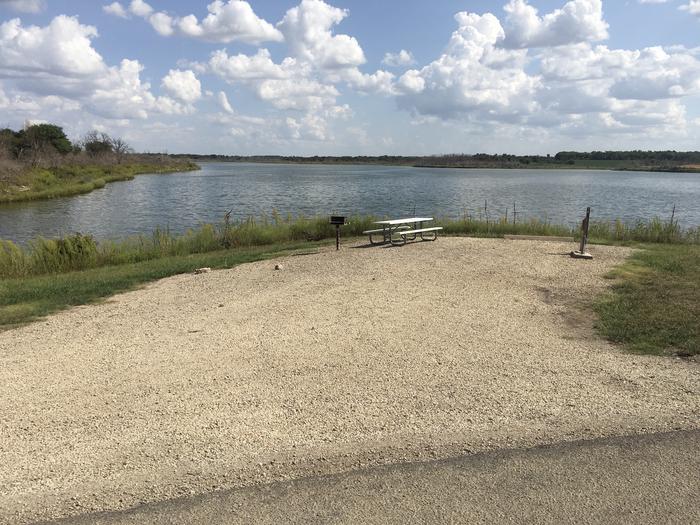 A photo of Site A019 of Loop A at CURTIS CREEK with Picnic Table, Electricity Hookup, Fire Pit, Waterfront