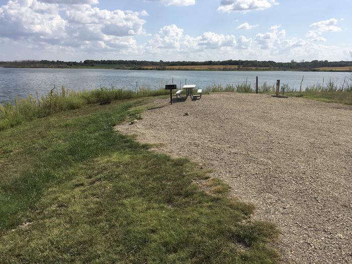 A photo of Site A019 of Loop A at CURTIS CREEK with Picnic Table, Electricity Hookup, Fire Pit, Waterfront, Water Hookup