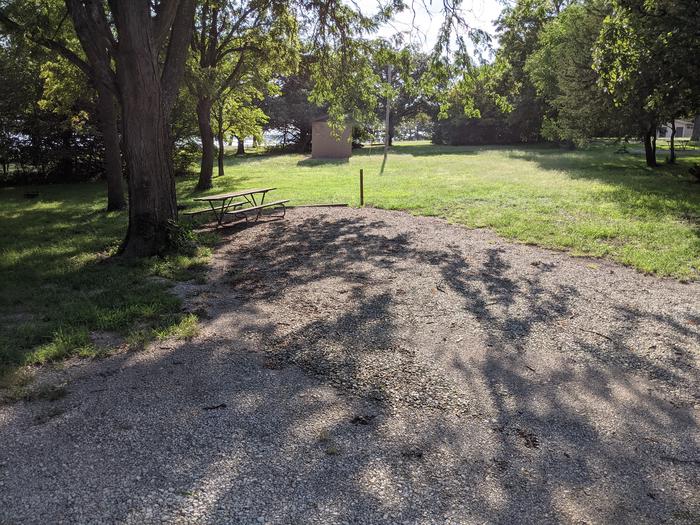 A photo of Site 5 of Loop A at Timber Creek Park with Picnic Table, Fire Pit, Shade