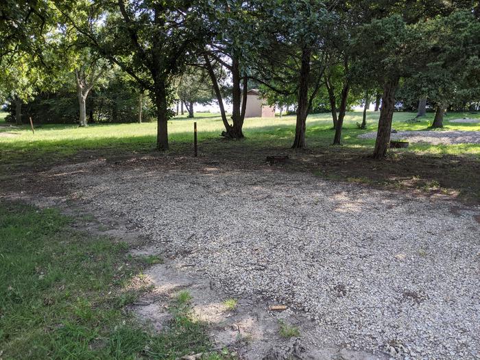 A photo of Site 6 of Loop A at Timber Creek Park with Picnic Table, Fire Pit, Shade